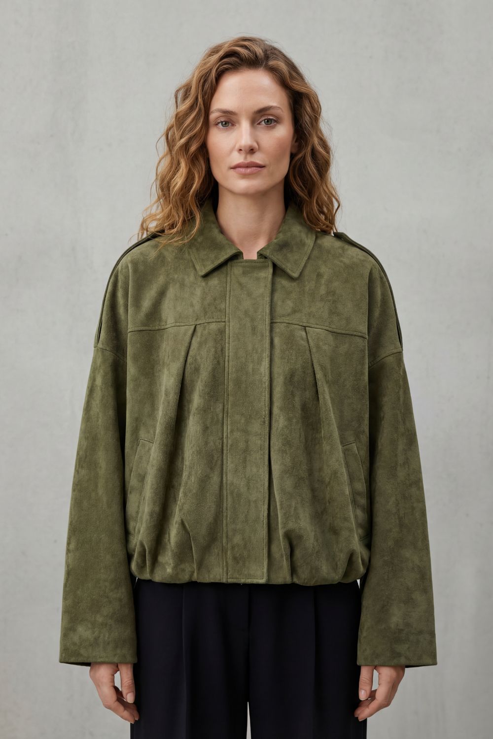 Chic olive women's bomber jacket with a trendy volume silhouette. Versatile outerwear for a modern look.