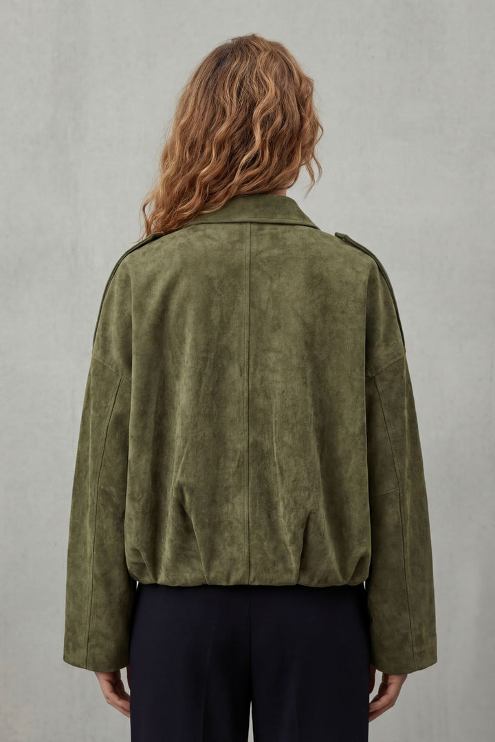 Fashionable brown women's volume bomber jacket, showcasing structured shoulders and a cozy collar.