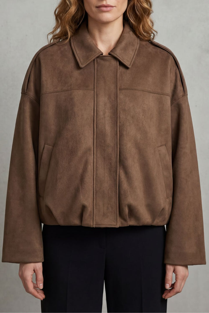 Model wearing a versatile women's volume bomber jacket, paired casually for everyday chic fashion.