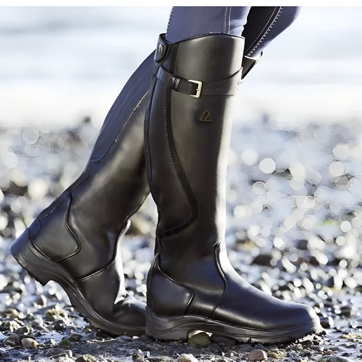 Close-up of women's waterproof ankle boots, highlighting the sturdy material & side zipper detail.