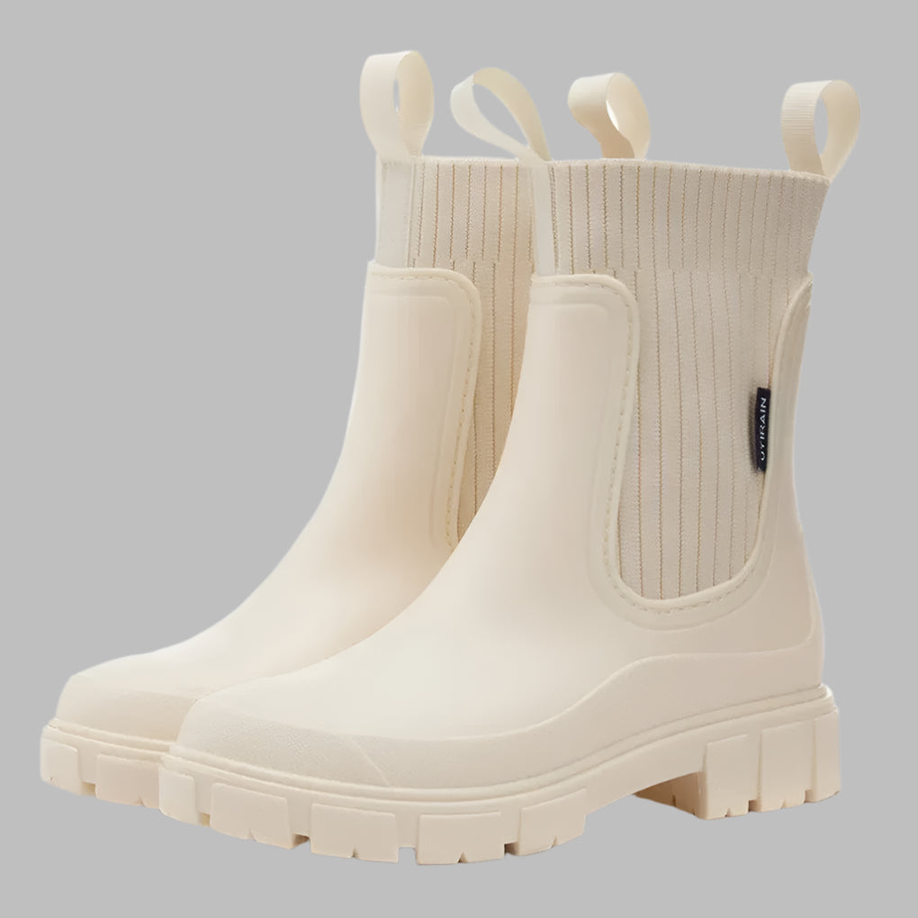 New3 women's fashionable waterproof rain boots for versatile all-weather comfort. Slip-on design for ease.