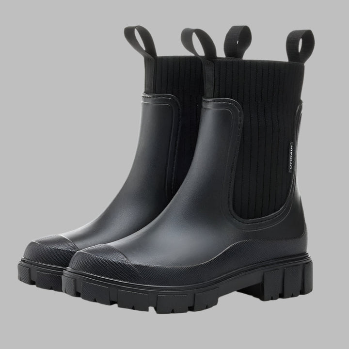 Chic women's waterproof Chelsea rain boots, offering slip-on comfort and protection for spring & fall.