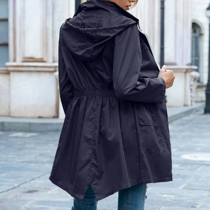 Fashionable women's long rainwear for autumn/winter. A sleek waterproof and windproof jacket with stylish appeal.