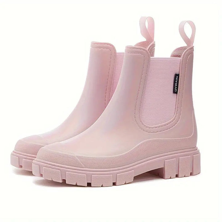 Fashionable women's rain boots offering waterproof protection. Ideal for daily wear in wet, rainy conditions.