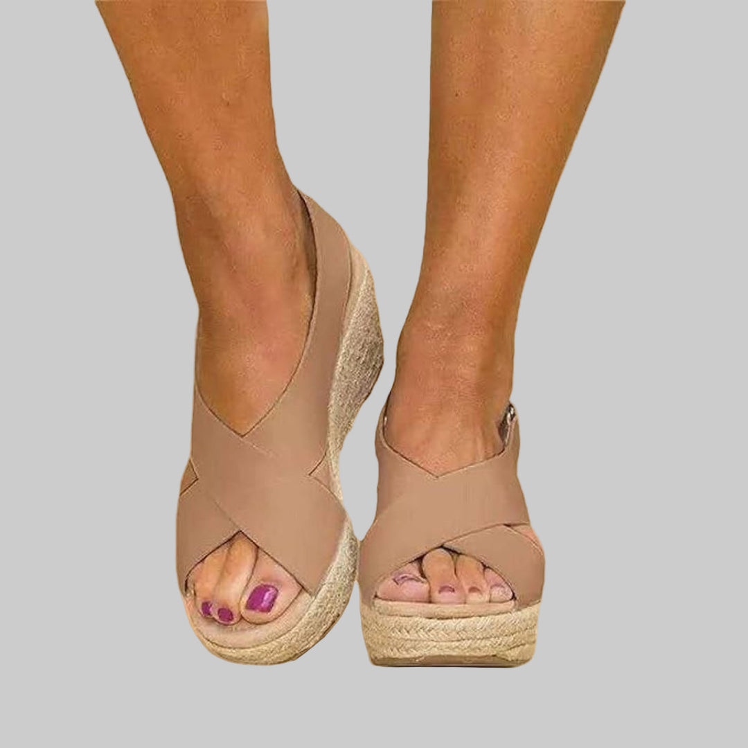 Casual ladies' open-toe wedge espadrilles. Comfortable slide-on summer sandals with stylish woven detailing.