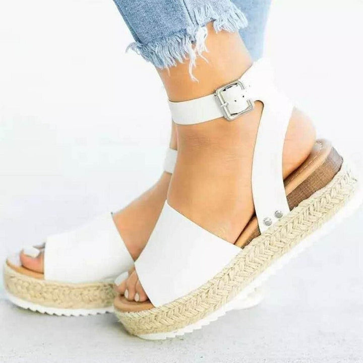 Chic women's platform wedge sandals, elevating your look for summer holidays & dressy casual outings.