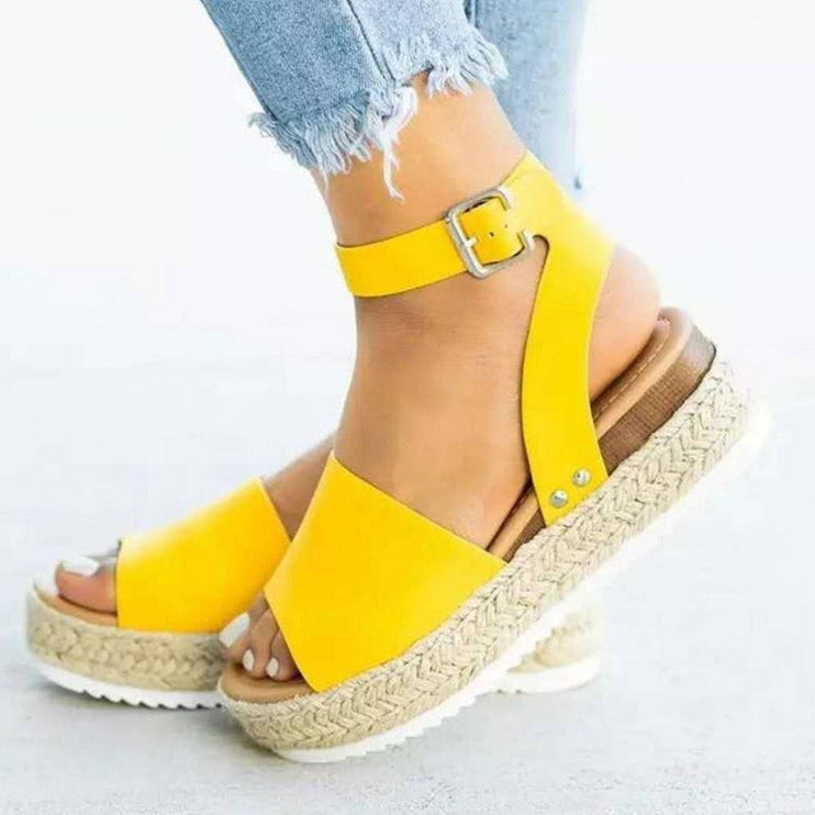 Comfortable women's wedge sandals with stylish ankle strap, ideal for summer fashion & everyday wear.