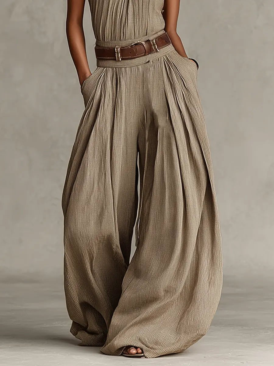 Women's taupe halter neck wide-leg jumpsuit, offering casual chic and bohemian elegance for summer comfort.