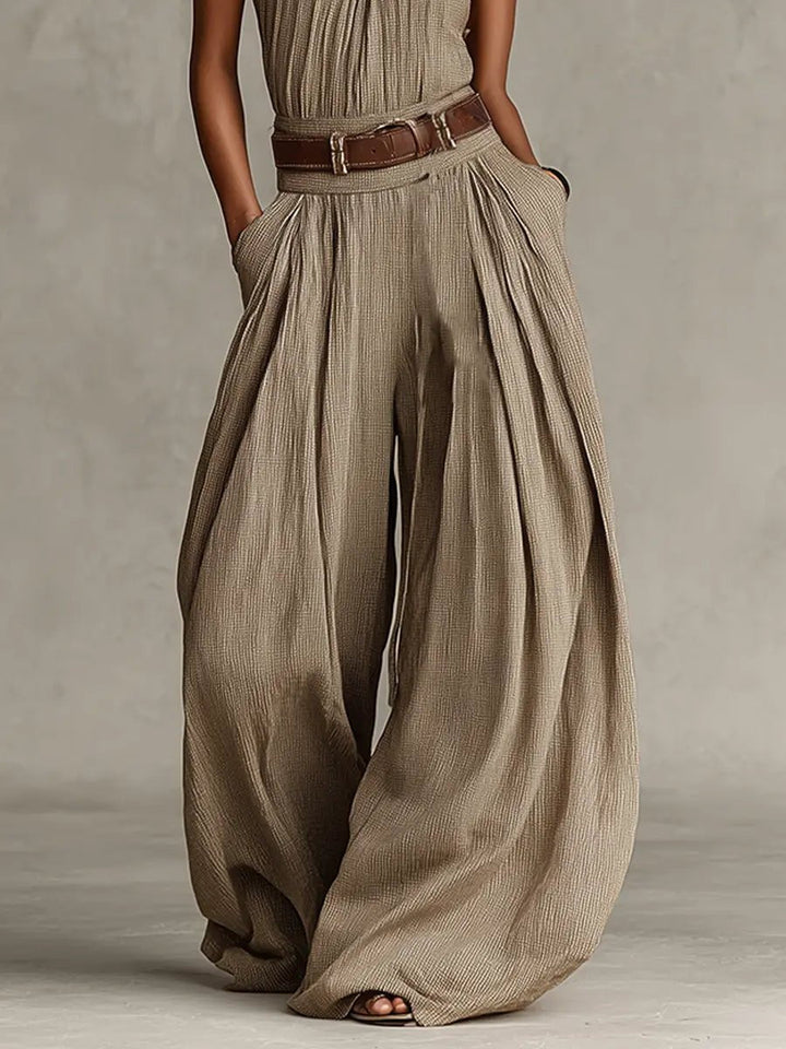 Women's taupe halter neck wide-leg jumpsuit, offering casual chic and bohemian elegance for summer comfort.