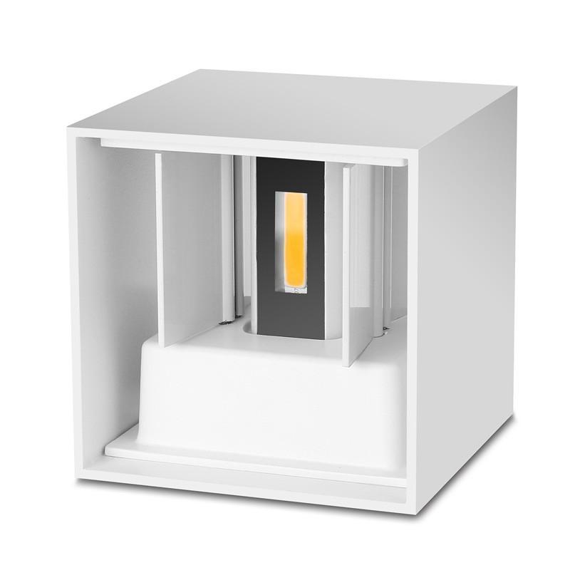 Tavey indoor/outdoor LED wall light, with adjustable beam for focused illumination.