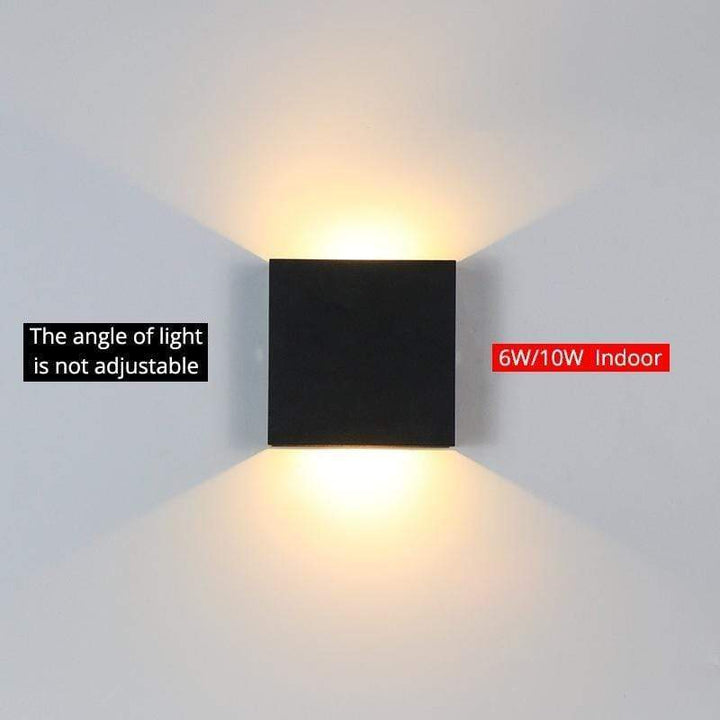 Tavey square LED wall light, black, providing accent lighting for contemporary spaces.
