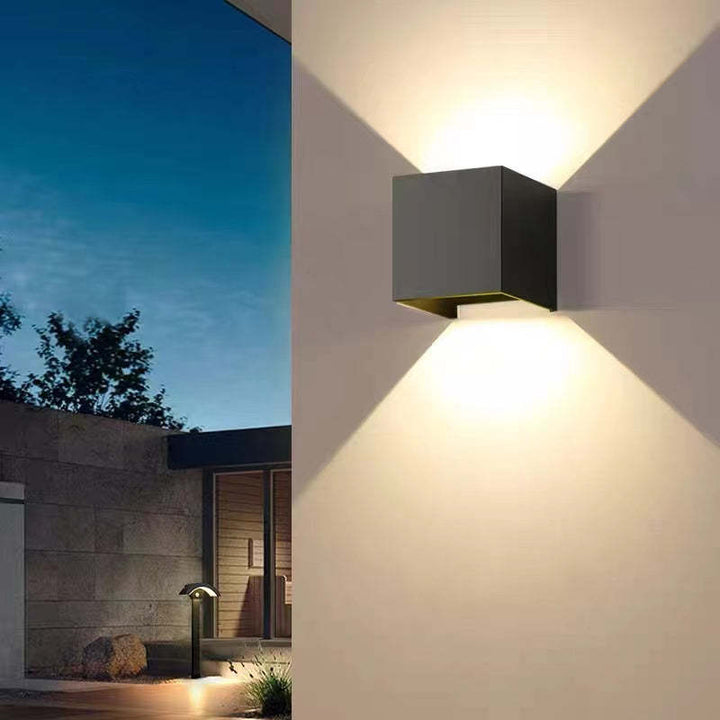 Contemporary Tavey LED wall light, square design, perfect for exterior home lighting.