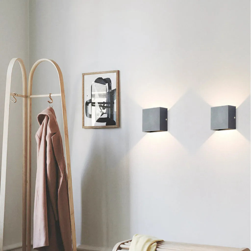 Outdoor Tavey LED patio light, black and modern, creating inviting exterior ambiance.