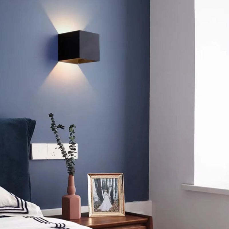 Energy-efficient Tavey LED wall light, a stylish choice for patio or indoor lighting.