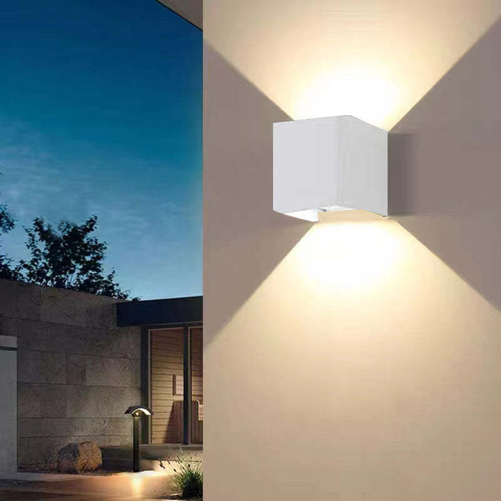 Durable Tavey modern LED wall lamp, weather-resistant, for exterior residential lighting.