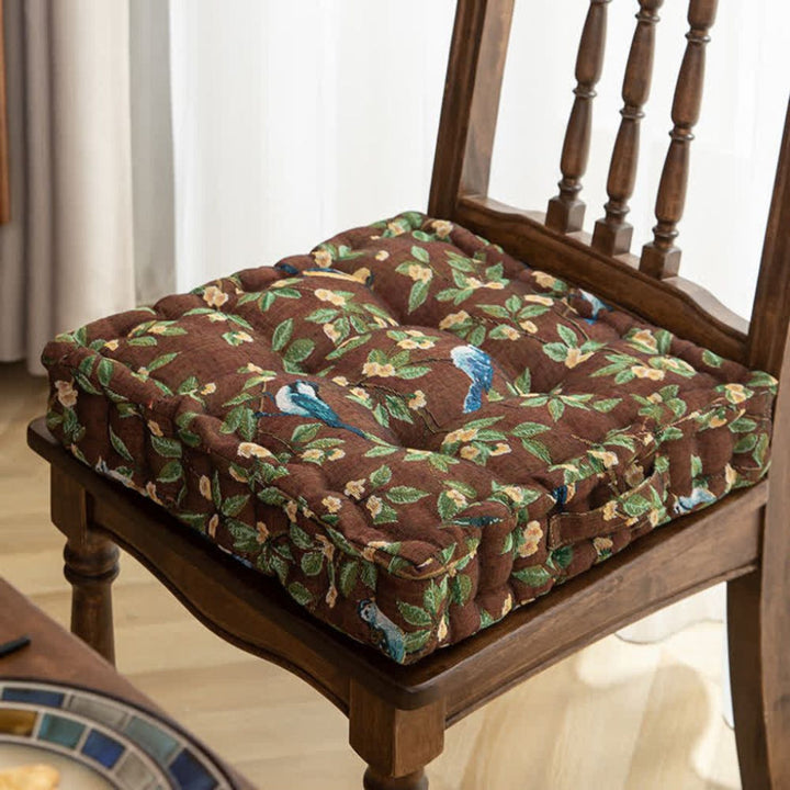Padded dining chair cushion with ties, square shape, bird leaf pattern, ideal for enhancing indoor decor.