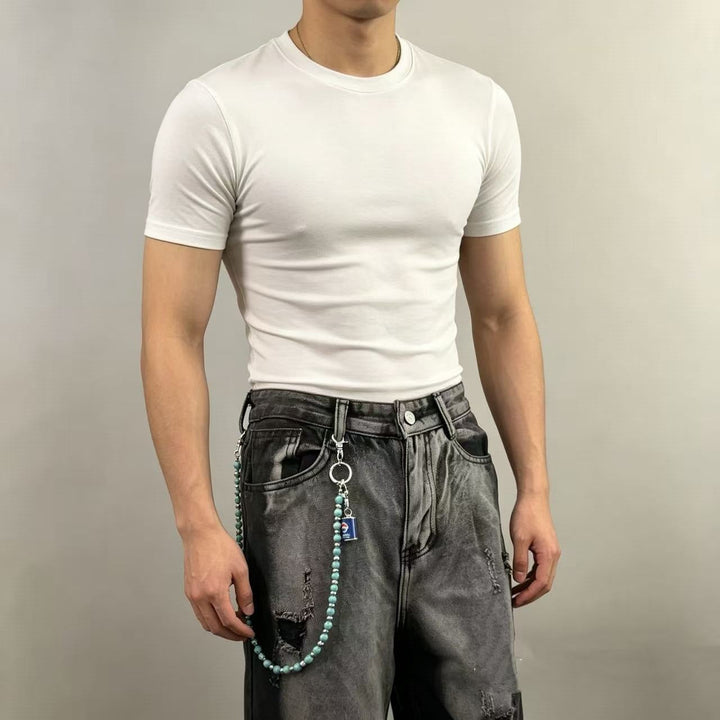 Fashionable women's short sleeve cropped top featuring a stylish chain pendant, ideal for trendy outfits.