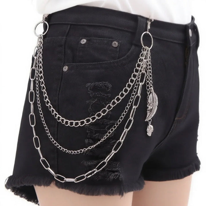 Stylish women's chain belt with multiple decorative pendants, a chic adjustable waist accessory.