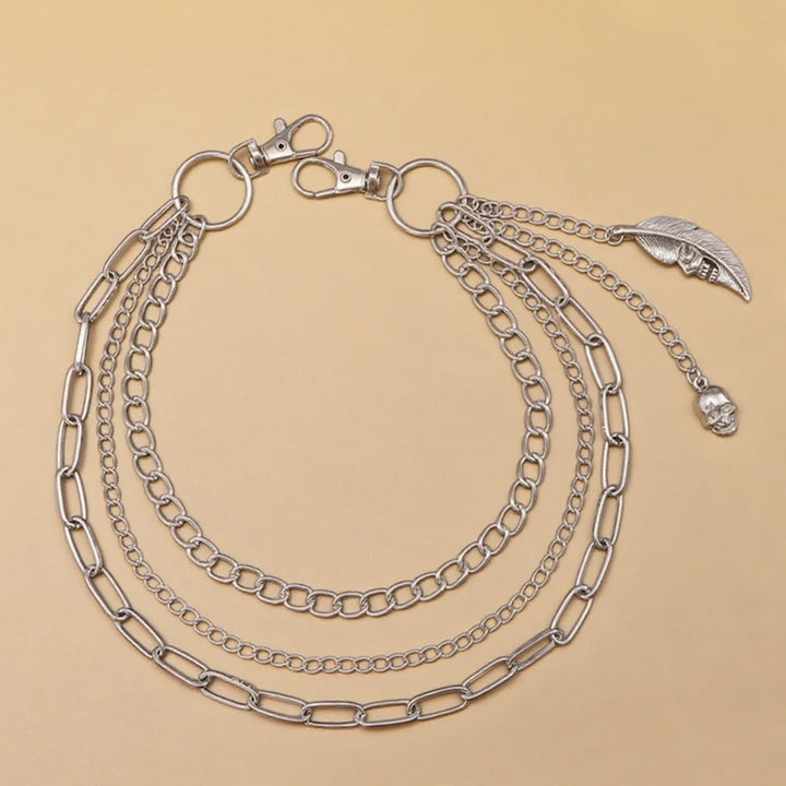 Elegant women's gold chain belt with dangling pendants, a versatile and trendy fashion statement.
