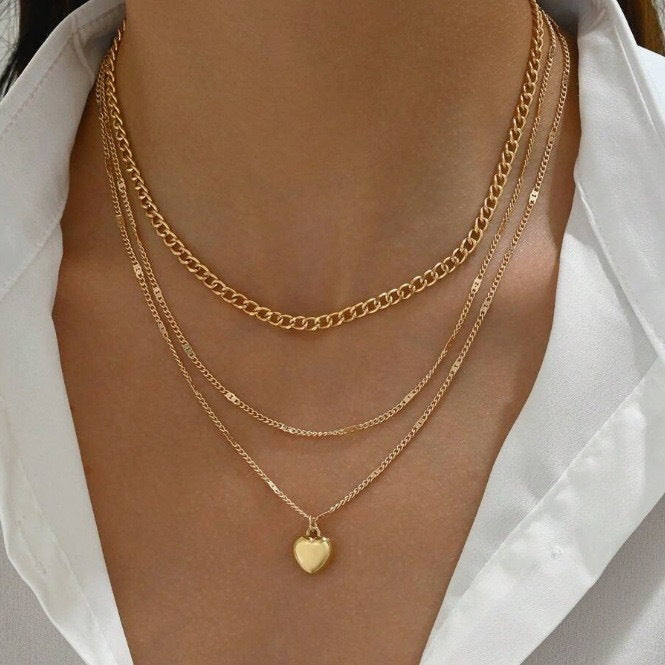 Elegant women's triple layered gold chain necklace, a versatile fashion accessory & gift for her.