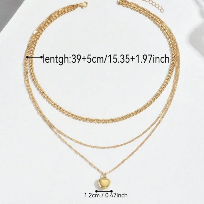 Luxurious gold layered chain necklace for women, an elegant jewelry gift with a heart charm.