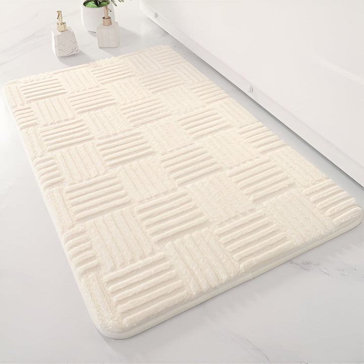 Soft, washable, non-slip shaggy bath mat. This absorbent cotton floor mat adds comfort and safety to your bathroom.
