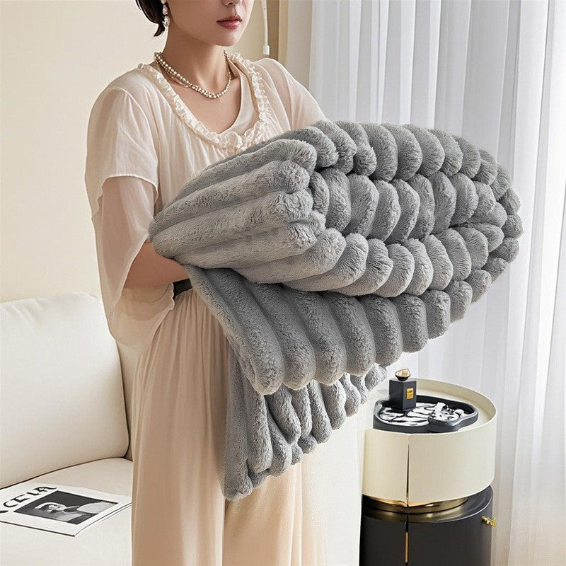 Beautifully textured women's cuddle blanket, ultra-soft plush fabric enhances any living room.