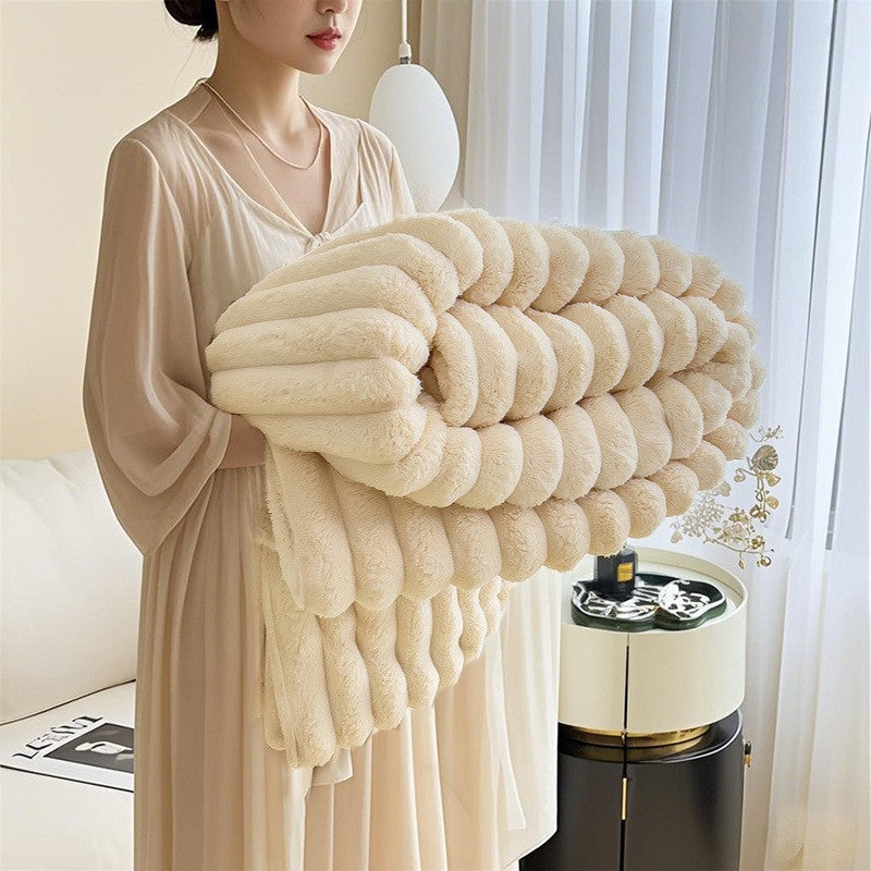 Close-up of a women's 3D textured cuddle blanket, showing its ultra-soft plush fabric.