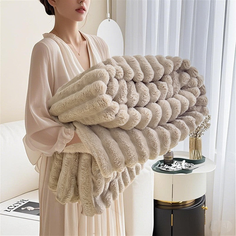Indulge in an ultra-soft 3D textured cuddle blanket, a warm and cozy women's plush throw.