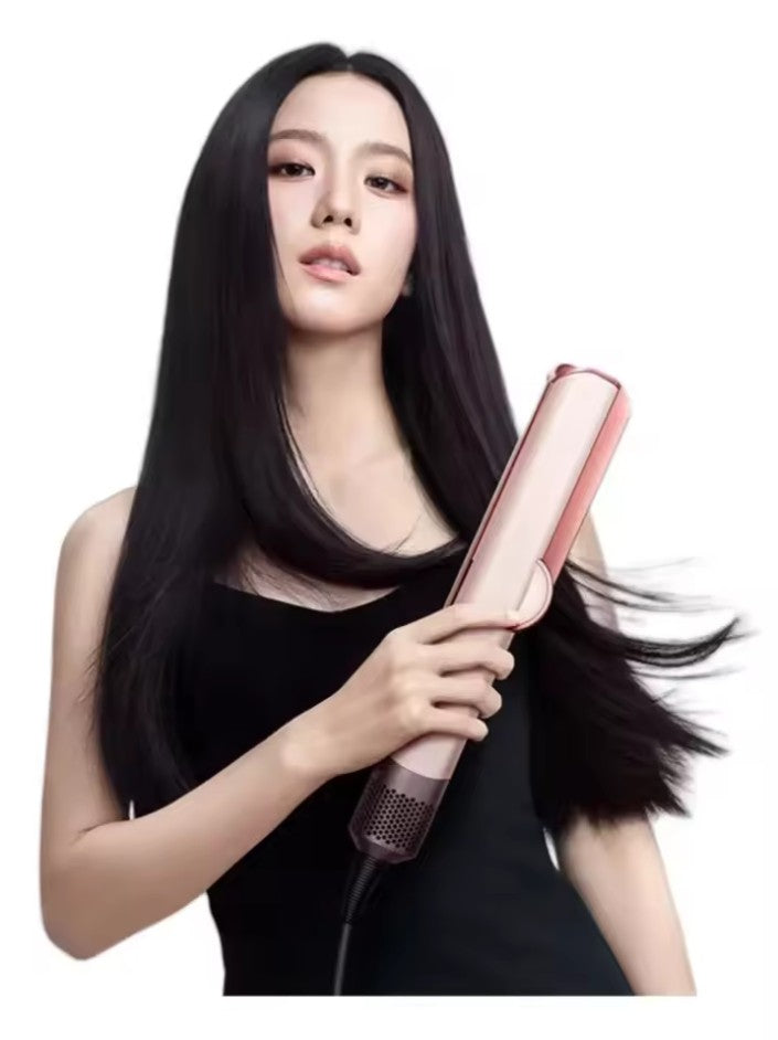 Styling hair with a versatile 2-in-1 dryer and straightener for sleek, smooth, and frizz-free results.