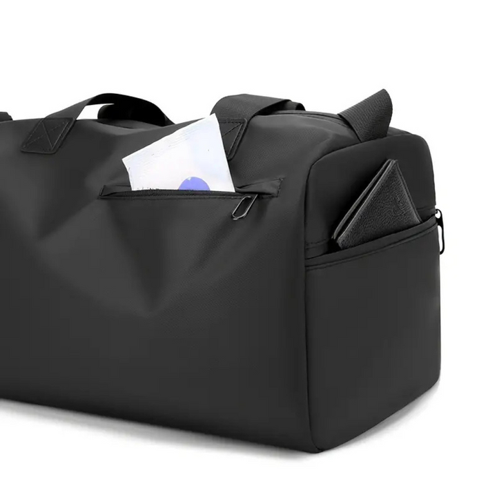 Sleek black 20L unisex waterproof sports bag with shoulder strap & shoe compartment for gym/travel needs.