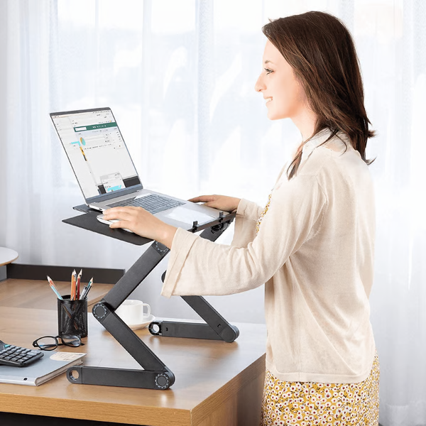 360° adjustable ergonomic laptop stand with built-in ventilation for improved posture & device cooling in any desk setup.