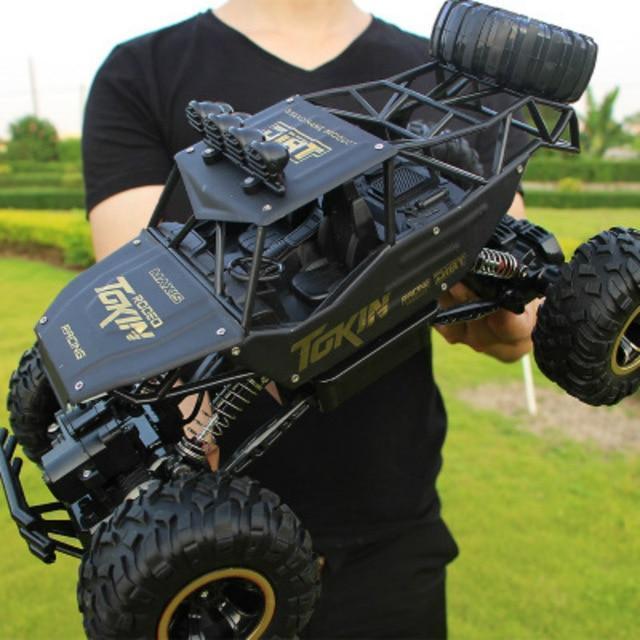 Unisex 4x4 RC Monster Truck, high-speed off-road remote control toy. Durable electric all-terrain vehicle for adventure.