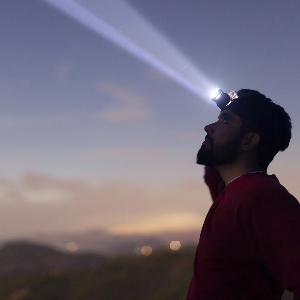 Versatile 5000 lumen rechargeable LED headlamp for camping, hiking, fishing, and hands-free night running.