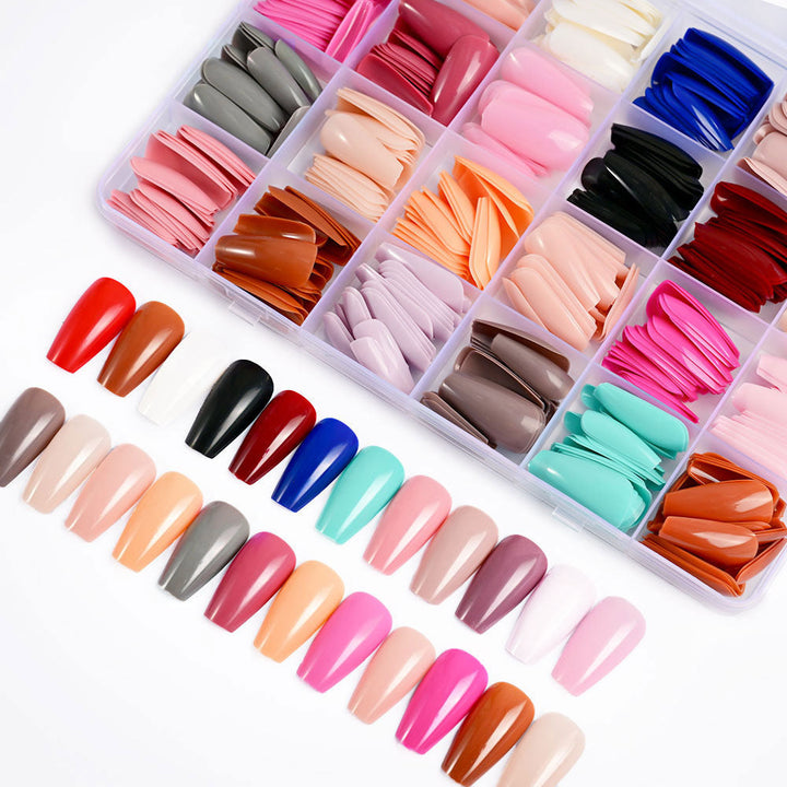 Applying clear gel nail tips from a 576-piece kit, ideal for DIY nail extensions & professional salon use.