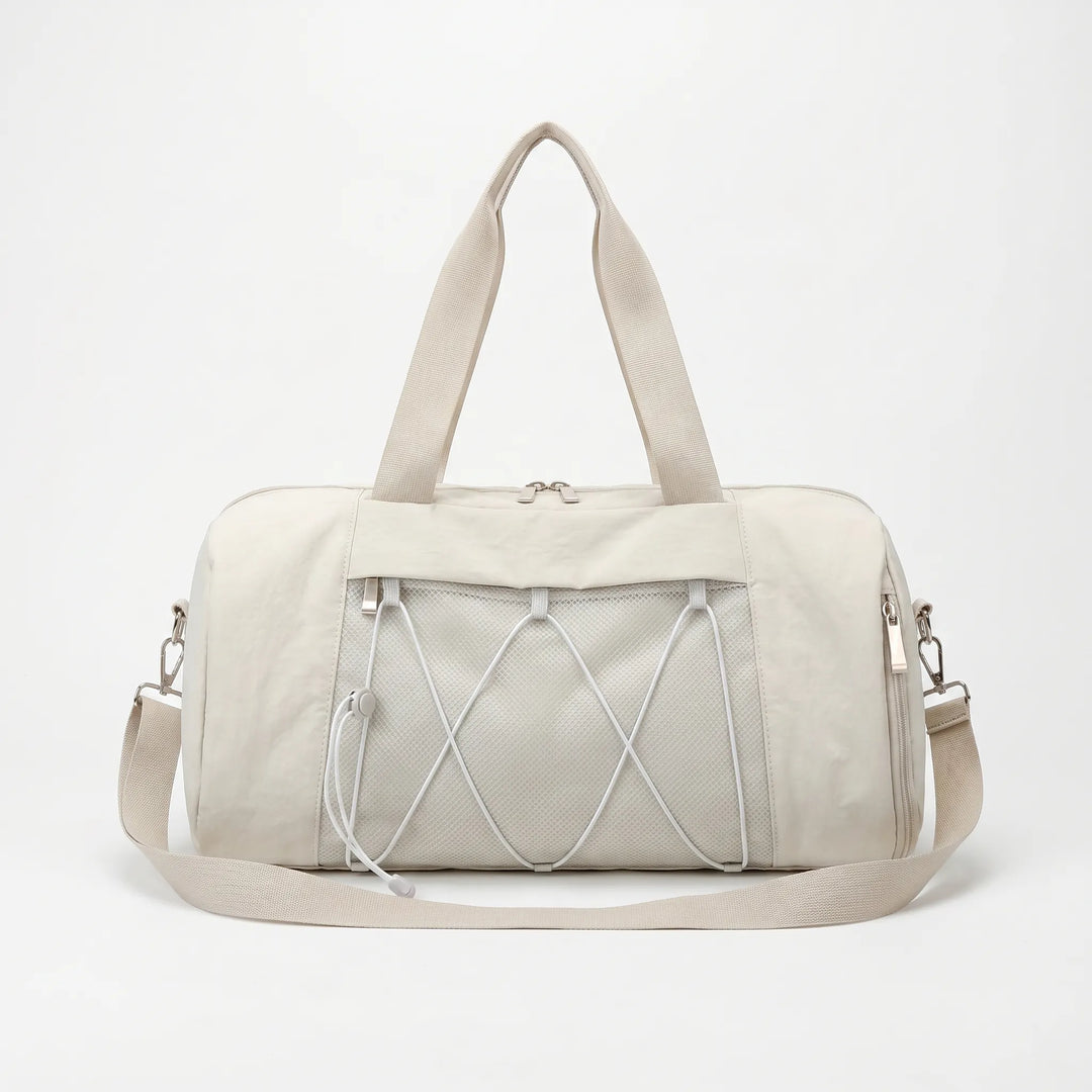 Stylish unisex workout duffel bag with spacious main compartment & side pockets for active gym-goers.