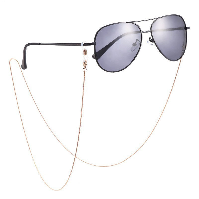 Stylish metallic eyewear holder chain, adjustable for unisex use. Securely keeps glasses in place.