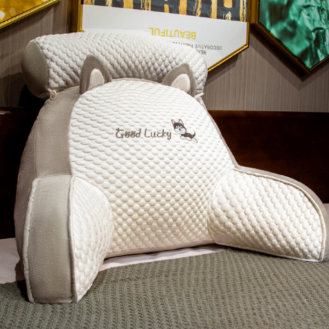 Plush back support pillow with a curved design for ergonomic comfort. Great for reading, relaxing, or office use.