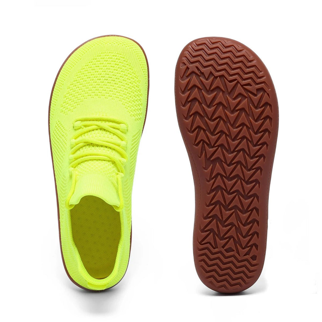 Zero drop minimalist trainers in a neutral color, providing natural comfort and a wide toe box for optimal foot spread.
