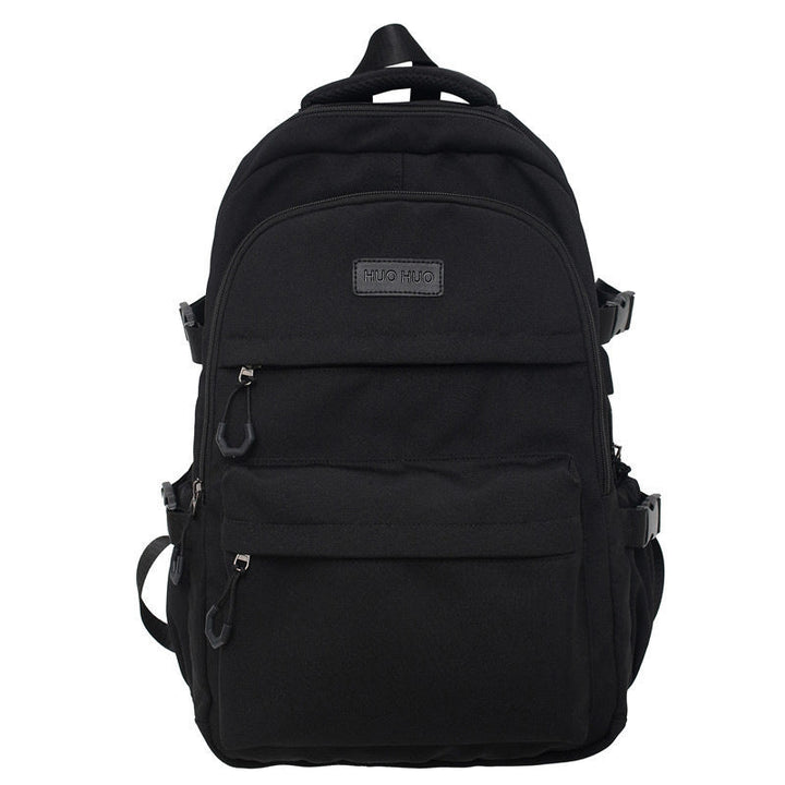 Unisex black everyday school backpack with multiple compartments & durable design for college students & daily carry.