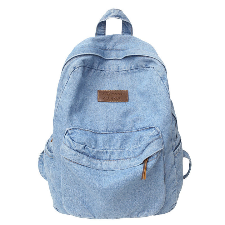 Casual blue denim travel backpack, lightweight & unisex, ideal school bag for students and daily use.