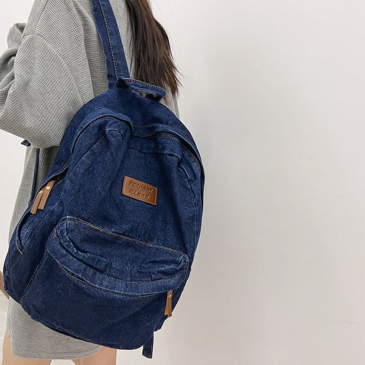 Durable unisex denim school backpack, stylish for travel & everyday carry, a versatile student rucksack.