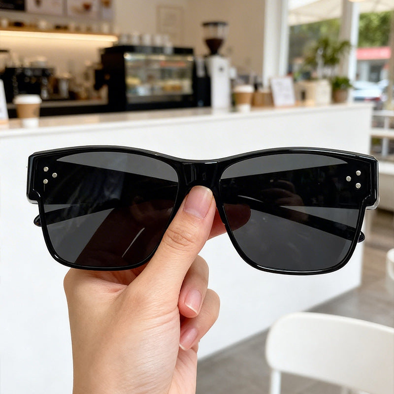Unisex bold geometric frame sunglasses with UV protection. Modern, lightweight fashion eyewear.