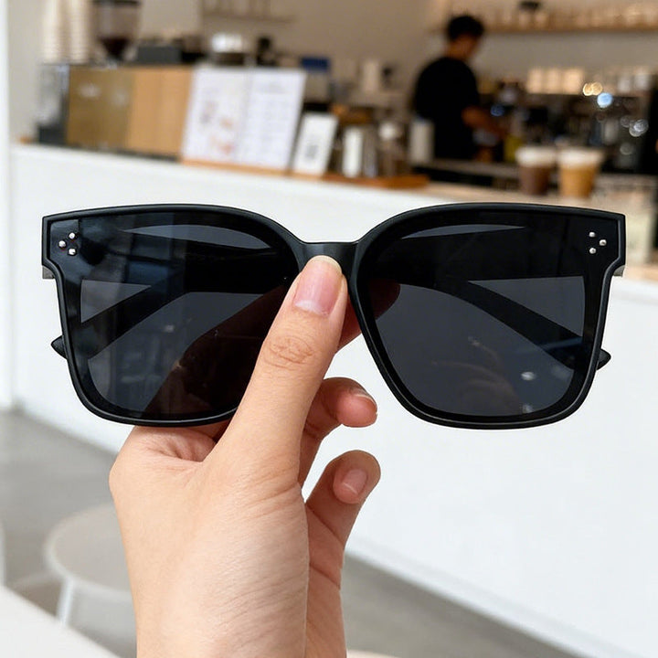 Modern unisex geometric frame sunglasses. Polarized lenses offer full UV protection. Fashionable eyewear.