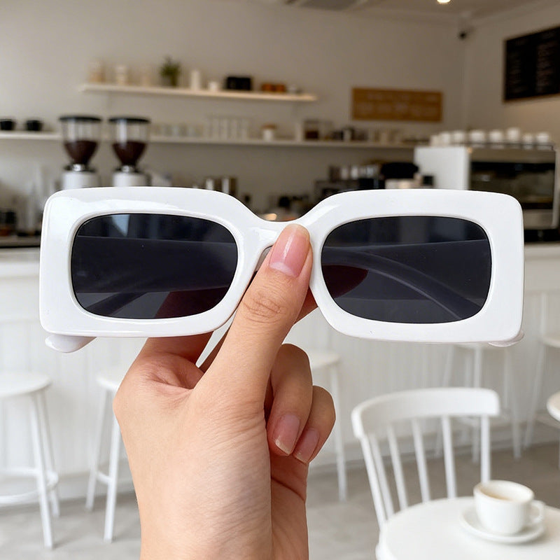 Unisex bold retro square sunglasses. Durable frame, ideal fashion accessory for summer style & essential UV protection.