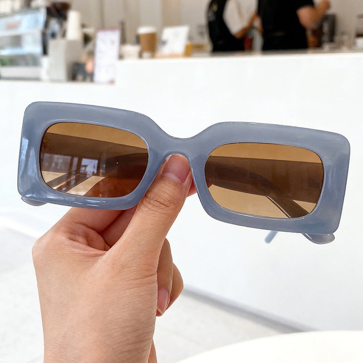 Durable unisex retro square sunglasses offering UV protection. A bold eyewear fashion accessory for modern summer.