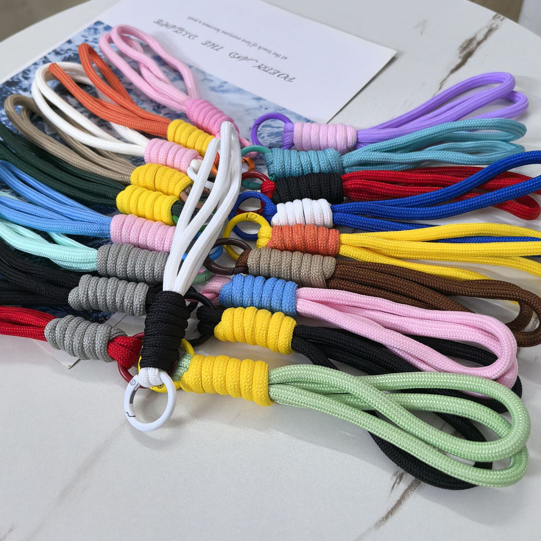 Unisex braided nylon keychain holder for keys, stylish and durable bag accessory.