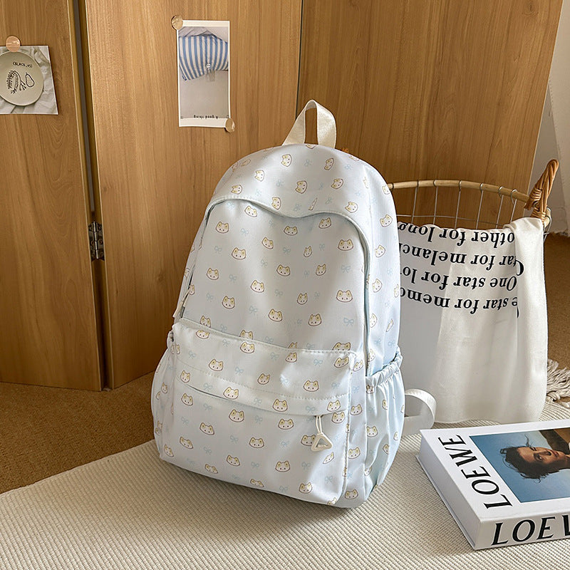 Playful unisex backpack in brown, featuring a cute cat animal pattern, perfect for school or casual use.