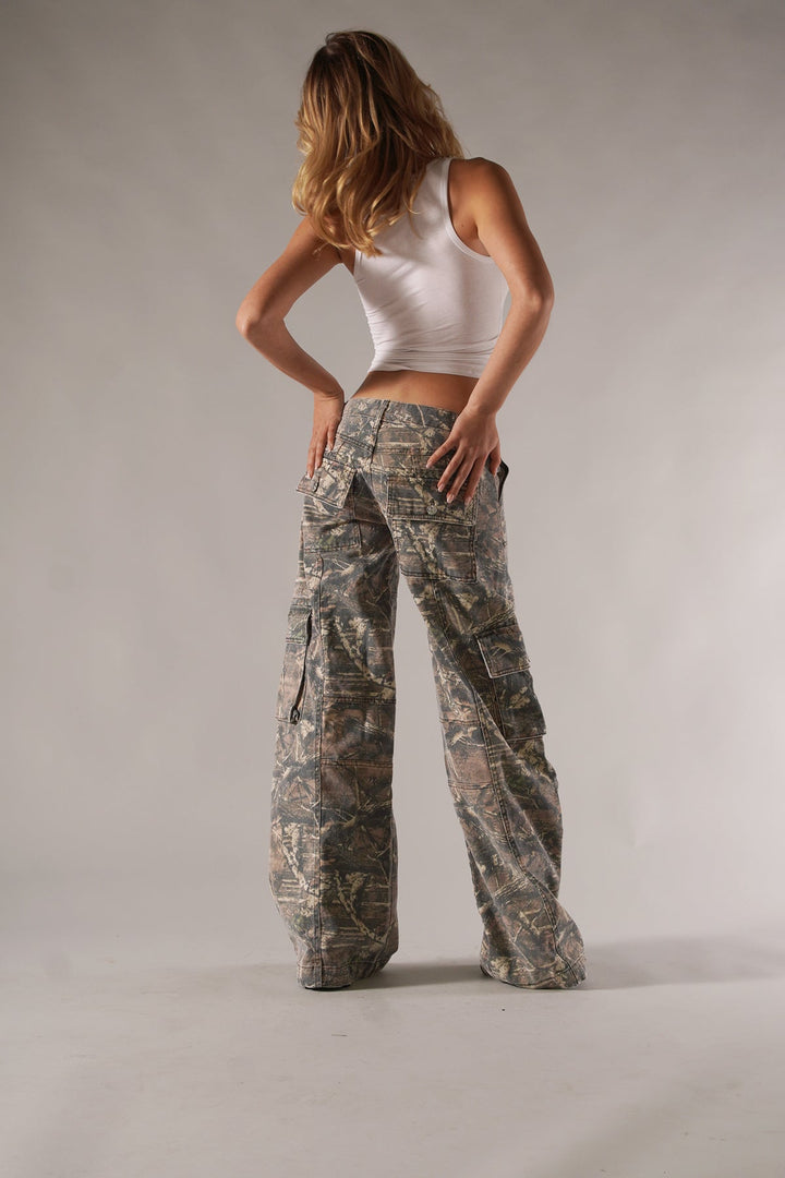 Close-up of women's military-style camouflage cargo pants, showing spacious utility pockets.