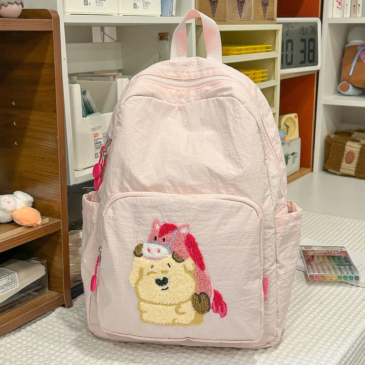 Kids' unisex travel backpack with colorful cartoon embroidery. Great for school, daily adventures & students.